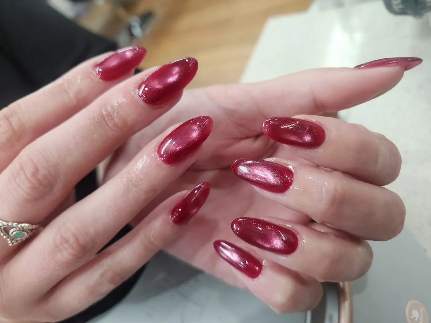 Deep red cat-eye nails done at Fancy Nails Edgecliff